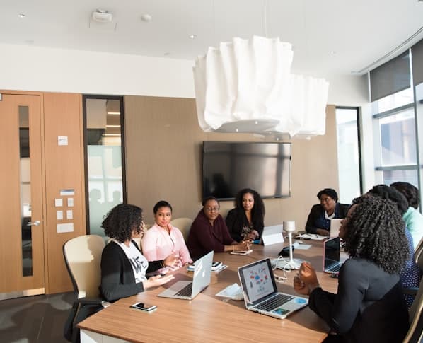 A team meeting in a glass-walled conference room