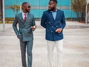 Two business professionals in conversation outdoors
